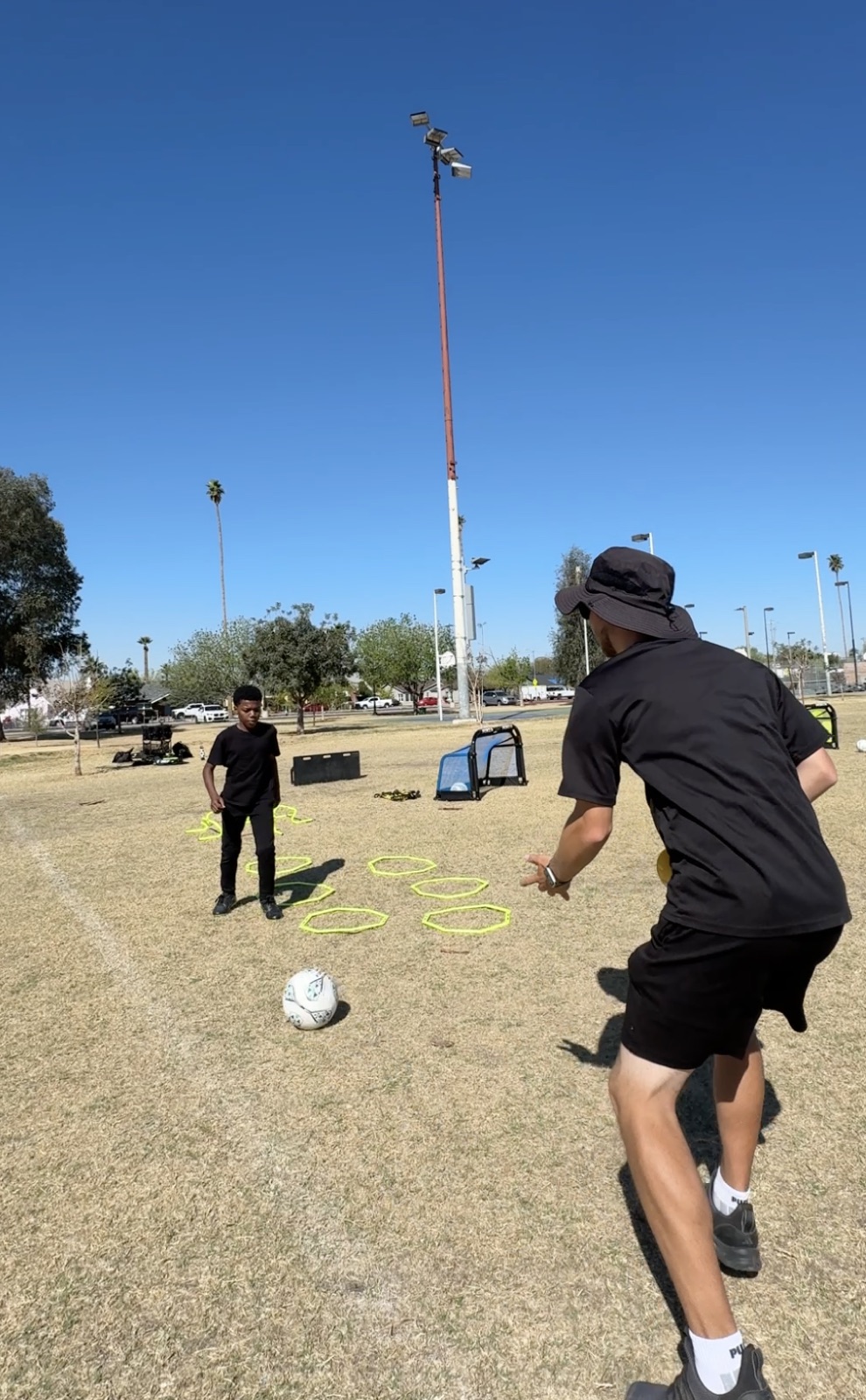 Coach David Fales demonstrating a shooting technique during a private training session.