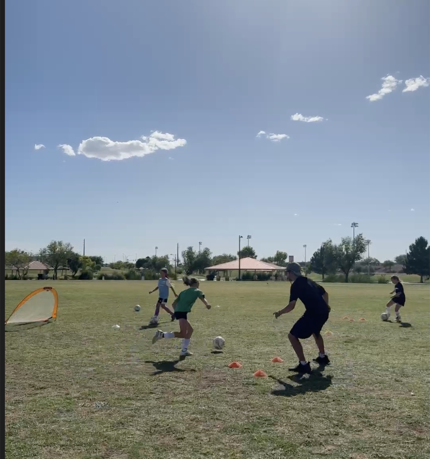 Players competing in a small-sided game during a training session with Coach David Fales.